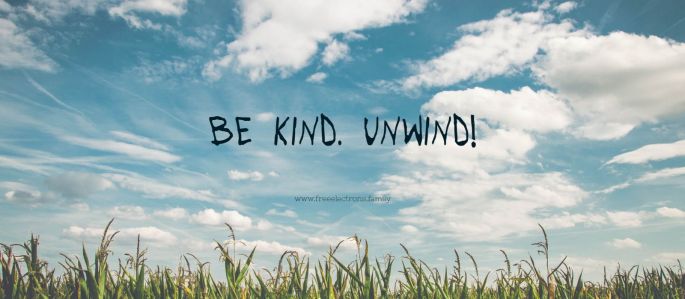 Be kind. Unwind. www.freeelectrons.family. Scattered clouds. Baby blue sky. uncut grass in the foreground. Big Smile!