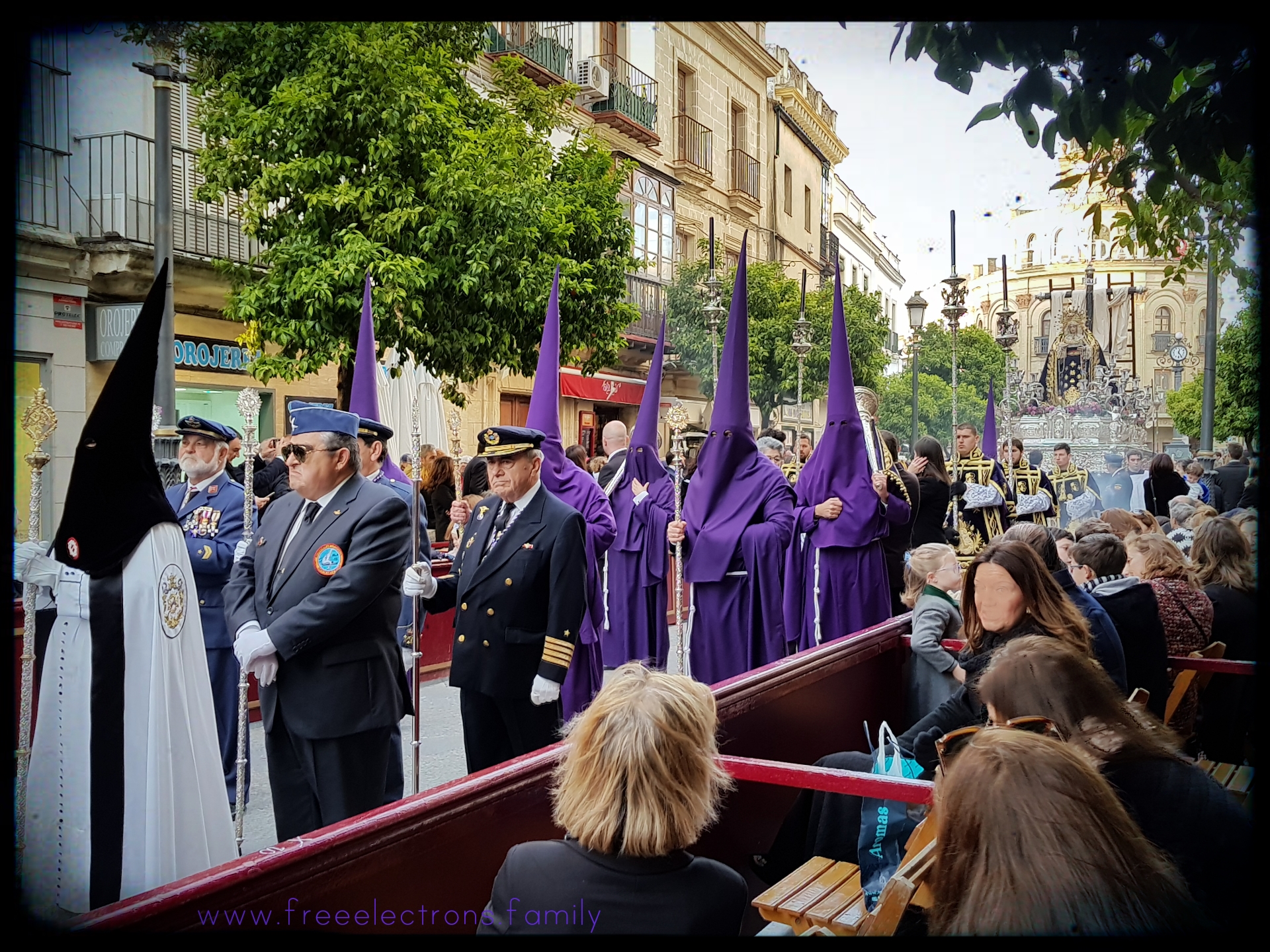 Easter in Jerez de la Frontera, Andalucia, Spain. Hooded penitents marching down calle Larga.