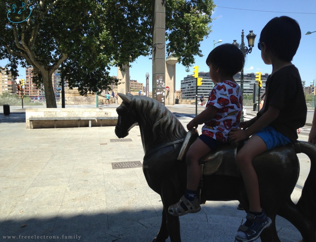 Two young boys on horseback (monument of one horse) entering the city from the Puente de Piedra (Stone Bridge) over the Ebro river. 

Third stop on our #FreeElectrons.Family summer camping road trip Europe, Day 5 in Zaragoza.