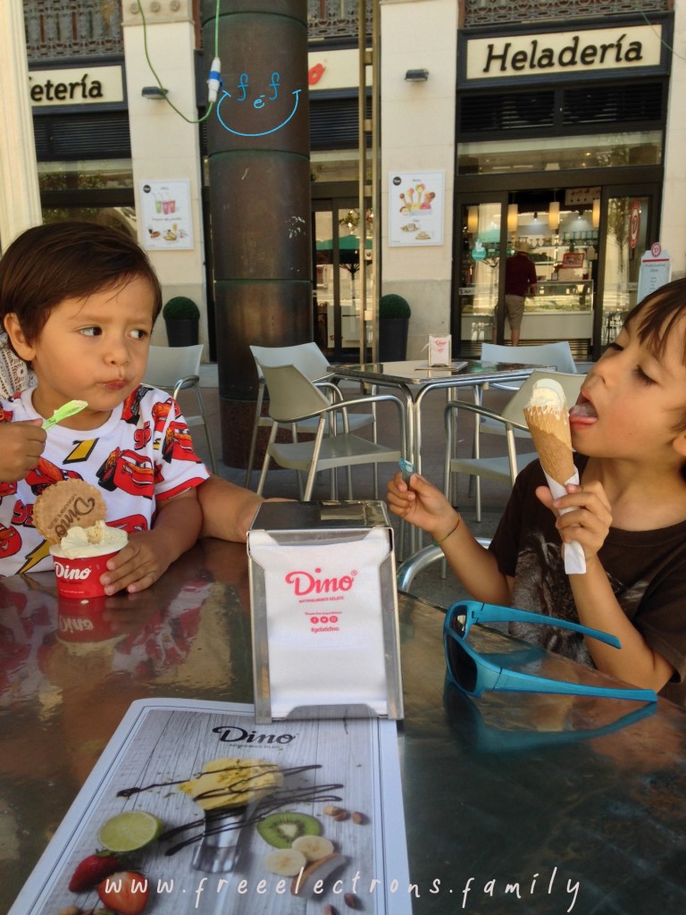 Two young boys cooling off from the sweltering summer heat with ice cream. Third stop on our #FreeElectrons.Family summer camping road trip Europe, Day 5 in Zaragoza.