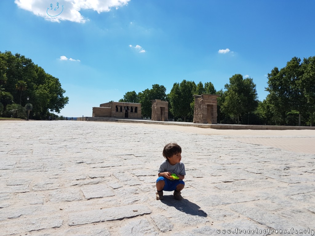 #FreeElectrons.Family - camping road trip Europe, Madrid. A young boy sitting, chillin' at the Temple of Debod--a 2,000 year old stone structure brought stone-by-stone from Egypt.