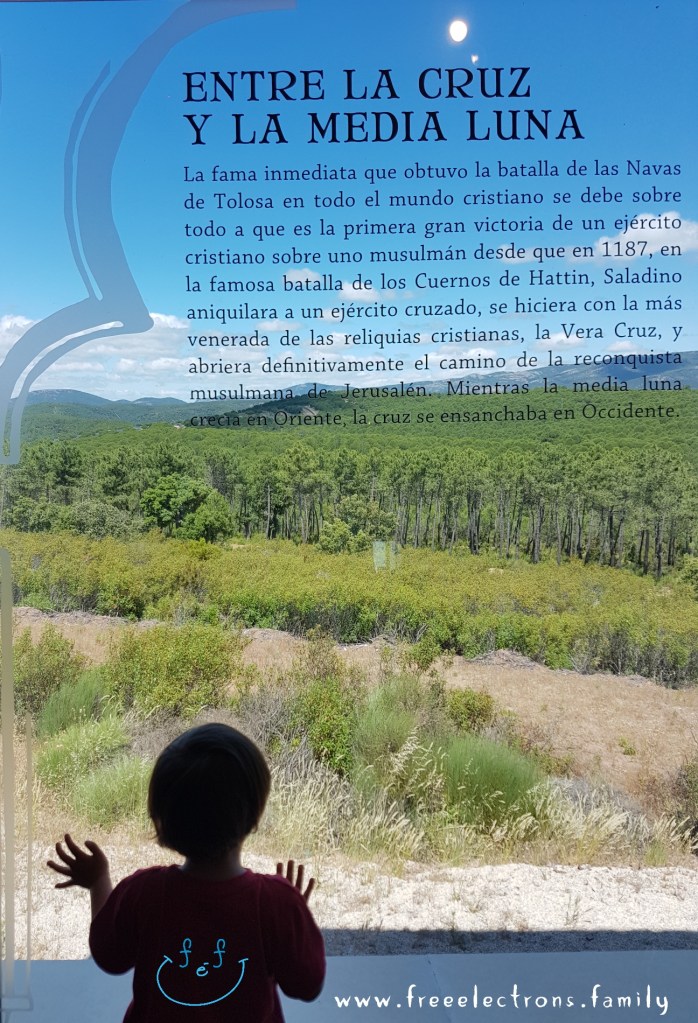 A young child stares outward from the bay window of the museum towards the mountain site of the decisive battle 
