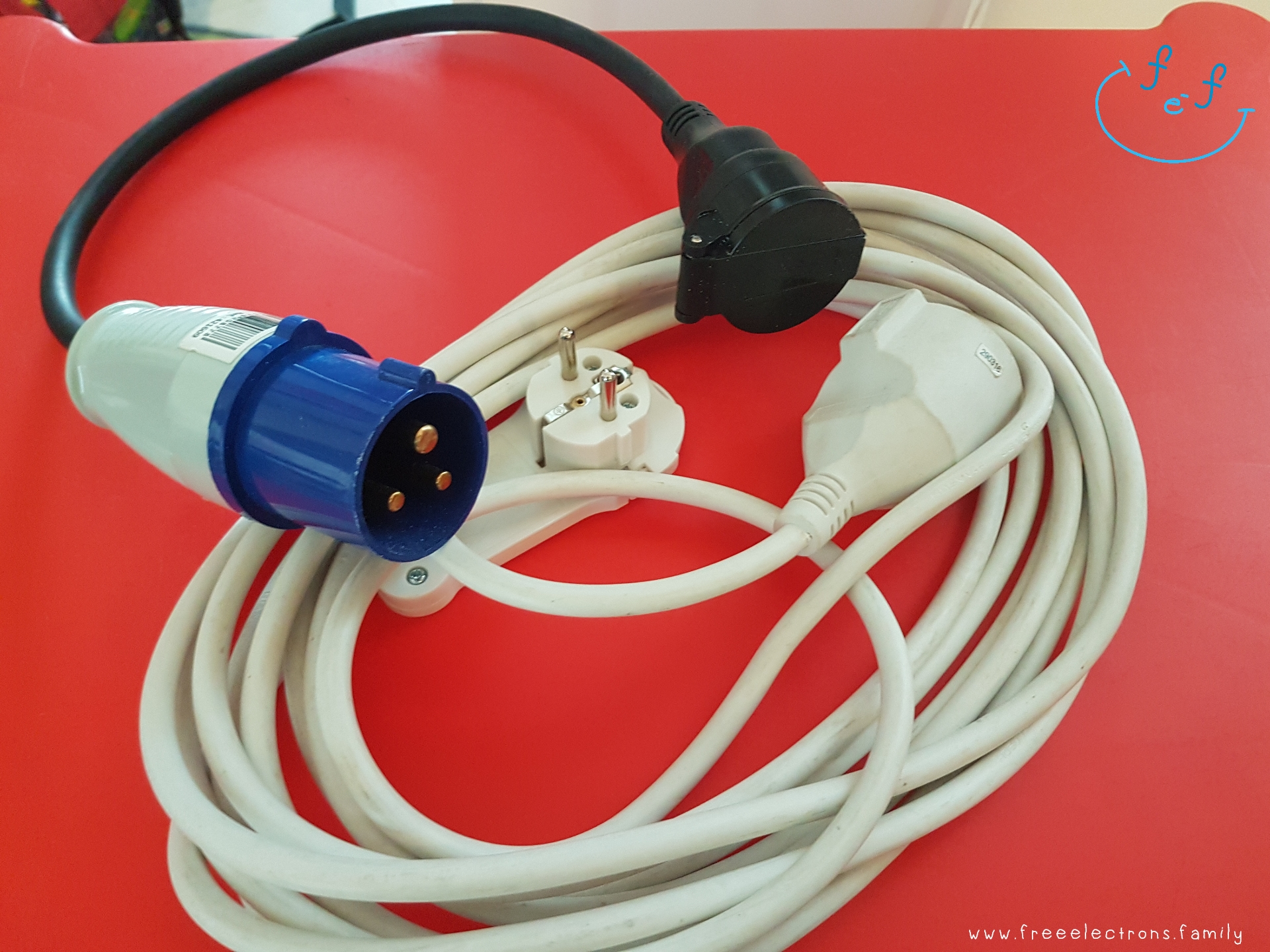 camping adaptor and extension cord.

Text reads: www.freeelectrons.family.

#FreeElectrons.Family - camping Europe, what to bring