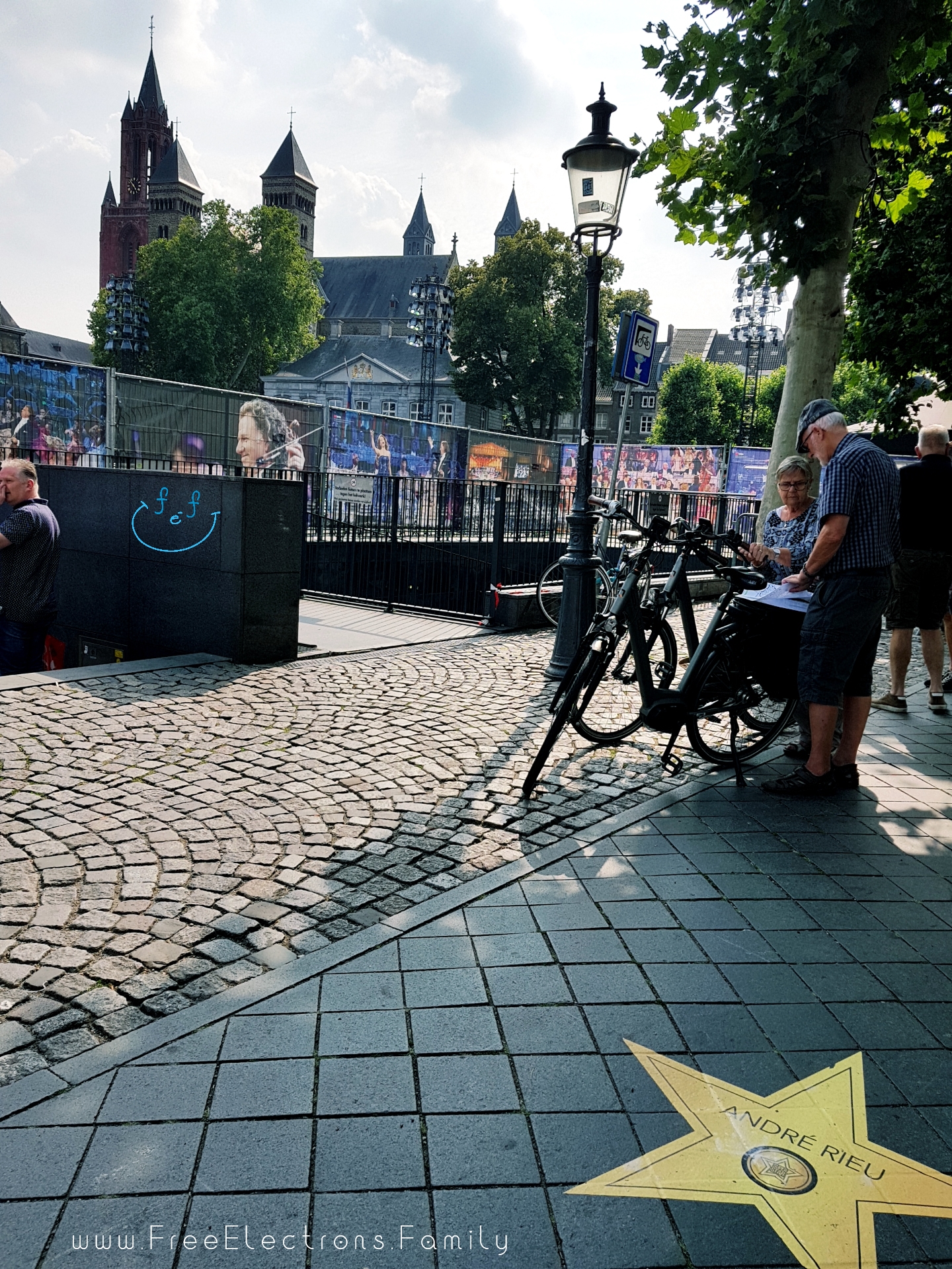 Maastricht, the city of Andre Rieu.  Pictures of the composer in the background in preparation for a concert.  A star on the street with the musicians name imprinted on it.

#FreeElectrons.Family - camping road trip Europe Maastricht