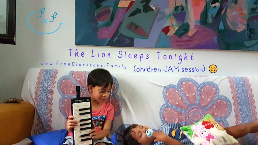 Two children on a sofa.  One is holding a melodica (music) instrument while looking at his little brother who is sleeping on the couch.

Text on picture reads: The Lion Sleeps Tonight, children jam session.

Caption Reads:  An open "jam session" for children: a family-fun activity!  Ok, ok!... the little one passed out right after the music session.  Yay!

www.FreeElectrons.Family.