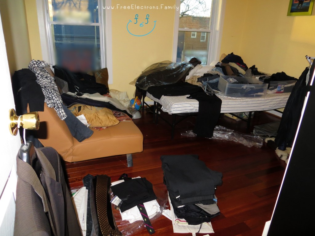 A bedroom with clothes on the floor, on the bed. . . everywhere.

Text:  www.FreeElectrons.Family
