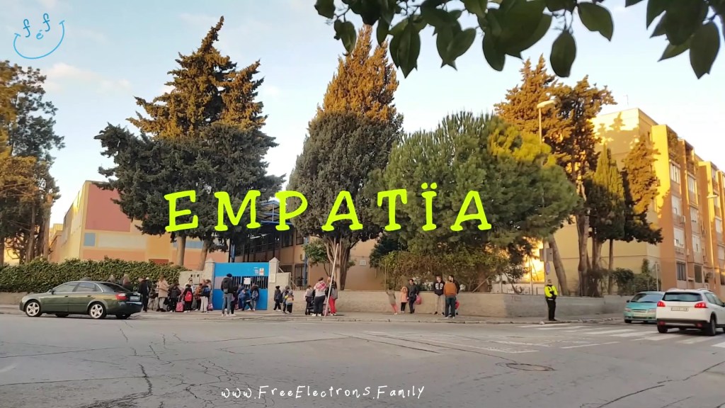 A wide shot of a school and street with children and parents await a school's opening.
www.FreeElectrons.Family