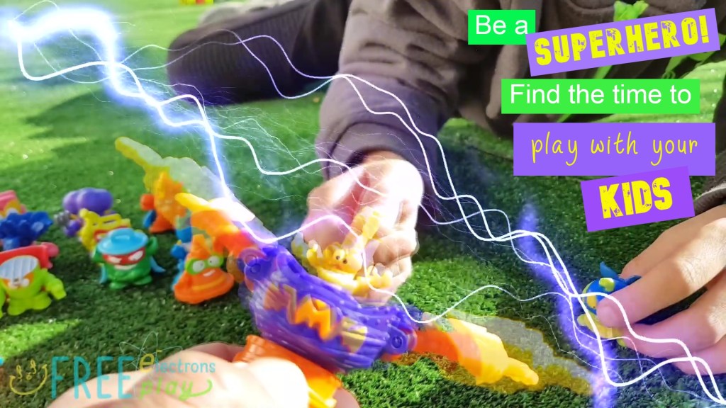 SuperZings toys with special lightning/electric effects.  Text reads, "Be a Superhero! Find the time to play with your kids."-Free Electrons Family