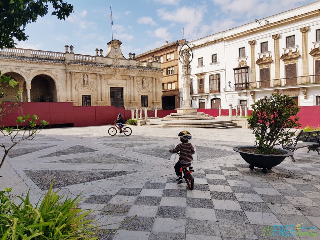 Two young boys on bicycles on a square, Plaza Plateros, Jerez de la Frontera during coronavirus lockdown in Spain.

www.FreeElectrons.Family  