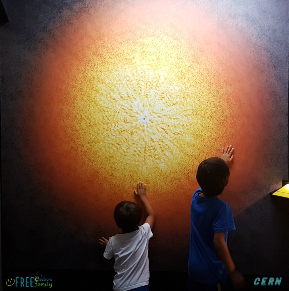 Two young children touching a wall of the BIG BANG!
#FreeElectrons.Family