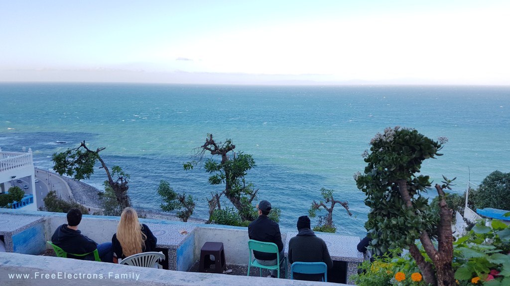 Loungers looking out to sea and the mountains of Spain beyond.