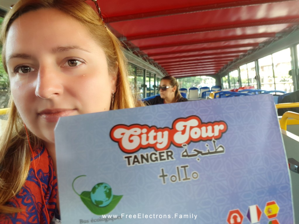 Close up of a beautiful woman on a city bus tour.